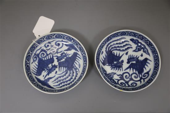 A pair of Chinese Ming blue and white phoenix saucer dishes, pseudo Wanli mark, 17th century, D. 13.5cm